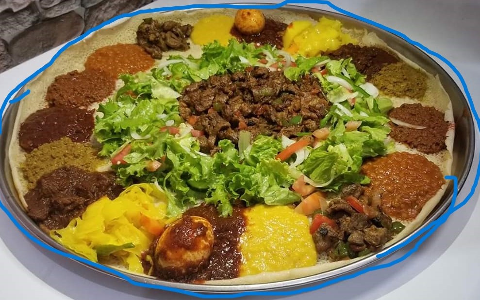 Ethiopian food platter with injera and colorful wats