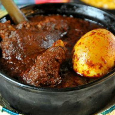 Doro wat, spiced chicken stew with injera